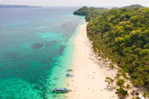 Puka Shell Beach. Wide tropical beach with white sand. Beautiful white beach and Stock Photos