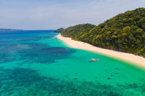 Puka Shell Beach. Wide tropical beach with white sand. Beautiful white beach and Stock Photos