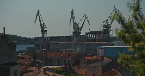 Pula Shipyard Cranes Above Old Town Rooftops Stock-Footage 335196346
