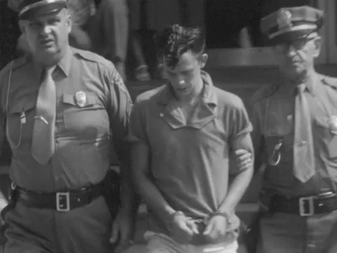 Pulaski, VA - 7/31/59: Man arrested and put into police car Video stock 234239555