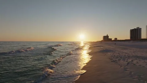Pull in aerial drone shot of sunset on Pensacola beach at sunset Stock Footage 302192321