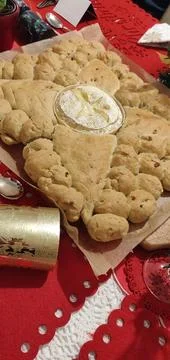 Pull Apart Bread with Cheese Dip Served on Festive Holiday Table Stock Photos