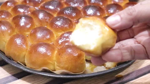 Pull apart bread demo , showing texture, softnese of the bread  Stock Footage 327352167