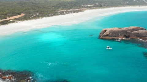 Pull away aerial shot of coast watch crew checking for sharks in a small boat Stock Footage 127478199