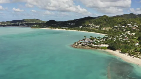 Pull away aerial view of Ffryers beach in Antigua and Barbuda Stock Footage 233227120