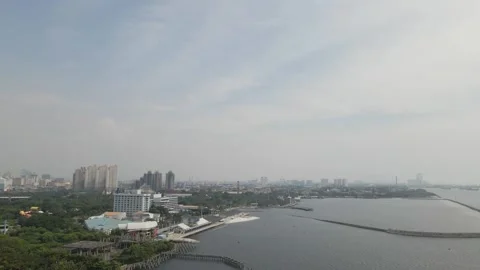 Pull away from the drone view of the city by the sea Stock Footage 259788654