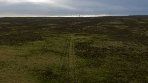 Pull away from grasslands and windmills, aerial over Big Island, Hawaii Stock Footage 108465310