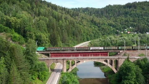 Pull away over the river and filming the train on the bridge 스톡 동영상 112856218