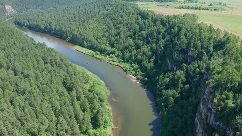 The pull away shot over the river and the cliff. Stock Footage 114125741