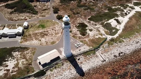 A pull away shot of Slangkop lighthouse, kommetjie, South Africa. Stock Footage 82480314