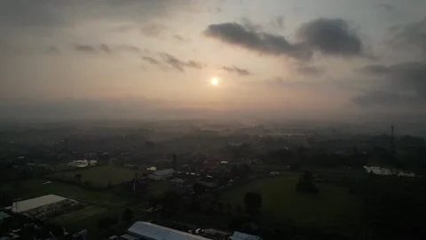 Pull away view of the sunset over the city at dusk Stock Footage 261931271