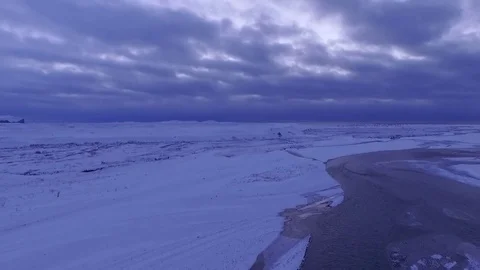 Pull back aerial of delta covered in snow Stock Footage 82874177