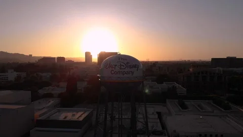 Pull Back Aerial Drone Shot of Walt Disney Water Tower Burbank Sunset Stock Footage 127805298