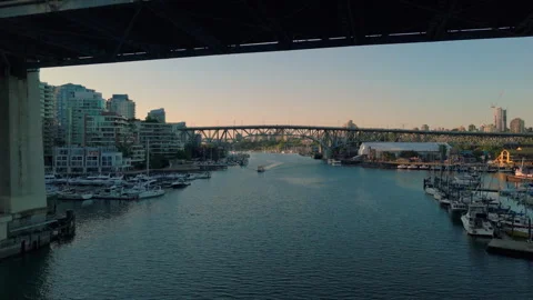 A pull back aerial from False Creek revealing the Burrard Street Bridge Stock Footage 315701298