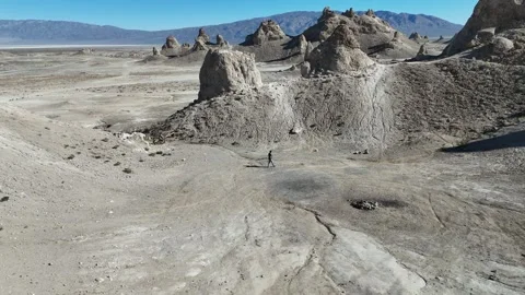 Pull Back Aerial: Person Standing at Trona Pinnacles, Vertical Stock Footage 327163913