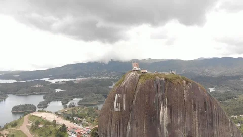 Pull Back From Aerial Piedra Del Penol Rock In Guatape Medellin 動画素材 96887807