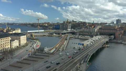 Pull back aerial of Slussen &amp; Golden Bridge construction site in Stockholm Stock Footage 129679027