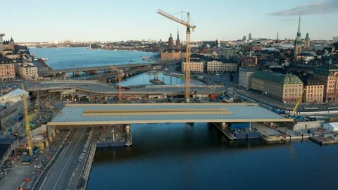 Pull back aerial view of Slussen &amp; Golden Bridge Construction site in Stockholm Stock Footage 129266675