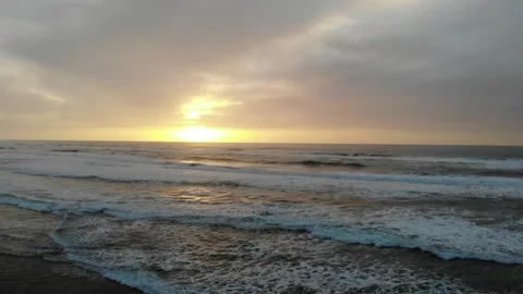 Pull Back and Away from Surf, Sunset Video stock 145236031