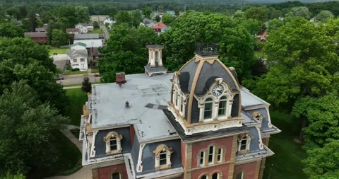 Pull back ascending flight viewing the old courthouse building and clock tower 스톡 동영상 335670869