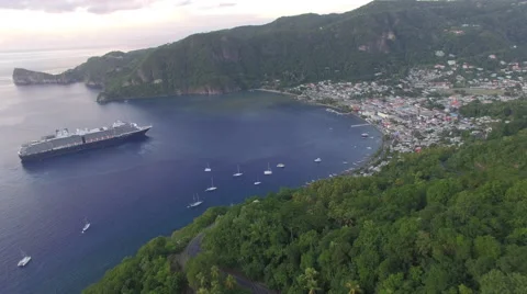 Pull back from boats and cruise ship docked at bay in Malta mountain Stock Footage 66340763