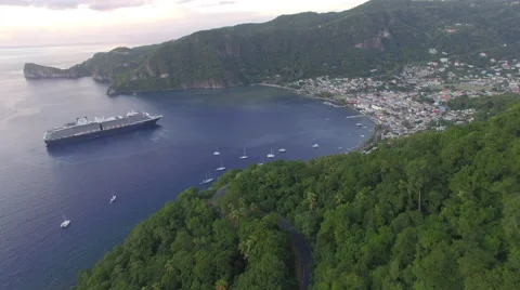 Pull back from boats and cruise ship docked at bay in Malta mountain Stock Footage 66340771