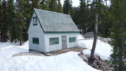 Pull Back from Cabin on Mosquito Lake in Winter Stock Footage 245532873