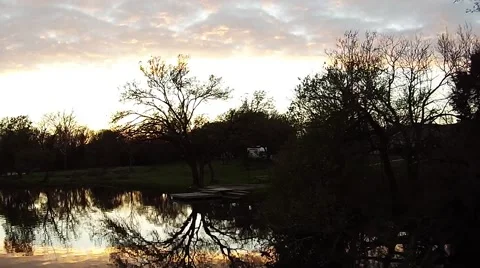 Pull back down the river at sunset Stockbeeldmateriaal 48002286