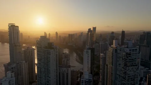 Pull Back Drone Shot Revealing Panama City Downtown Skyline at Golden Sunset 스톡 동영상 334339689