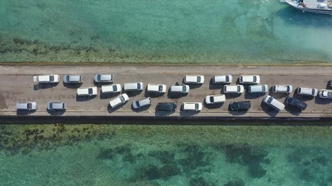Pull Back Drone Shot of Traffic Jam Cars on The Port Entering Nusa Penida Isl Stock Footage 113967758