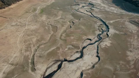 Pull back of dry lake with empty paths and curves Stock Footage 166109150