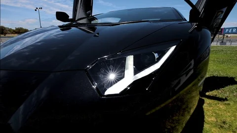 Pull back from extreme close up to wide shot of the Lamborghini Aventador Video stock 104770980
