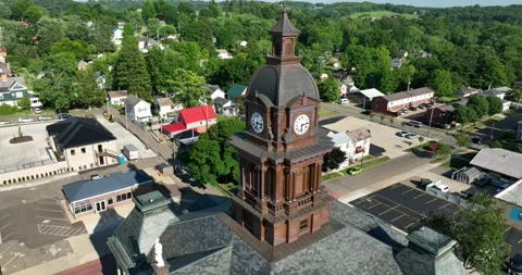Pull back flight starting by the clock tower on the courthouse Stock Footage 335672335