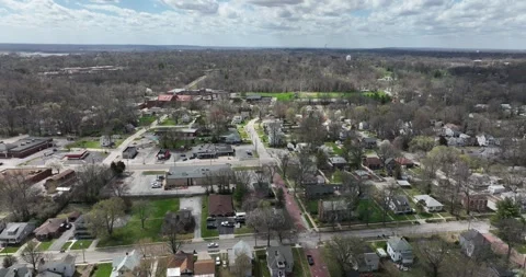 Pull back flight viewing houses businesses and streets Stock Footage 335669380