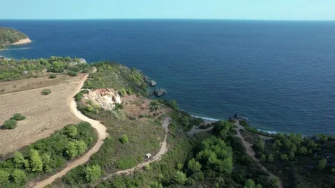 Pull back of land surface located by the coastline. 4K Drone Video. Stock Footage 164880713