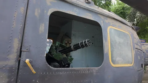Pull back from machine gun on US helicopter at War Remnants Museum, Ho Chi Minh Stock Footage 308997115