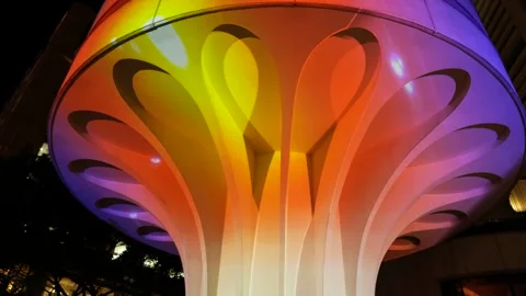 Pull back modern architecture lit up in neon lights 6K Stock Footage 311113059