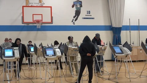 PUll back to multiple Ohio voters at electronic terminals. Stock Footage 106158990