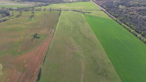 Pull Back Over Three Color Farmland Fields in Oklahoma Aerial 스톡 동영상 332128140