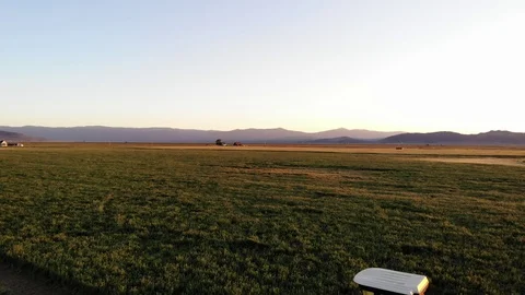 Pull Back Reveal of Farm Tractor - Aerial Drone Stock Footage 115065601