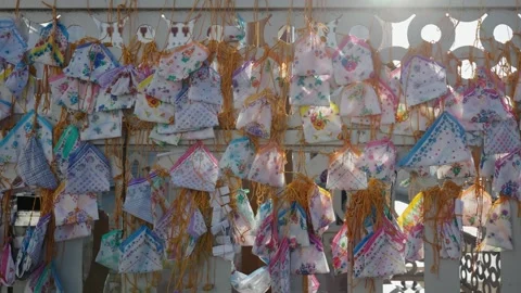 Pull Back Shot Reveals Woman Standing Near Hankies Tied at Velankanni Church Stock Footage 340007098