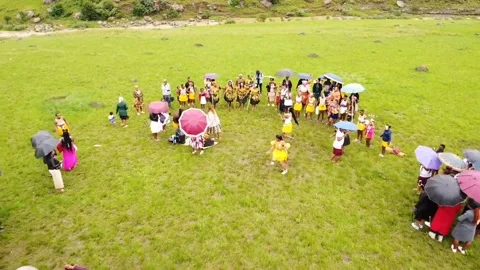 Pull back shot of a traditional Wedding on a field , Nkandla 2023 Stock Footage 282618418
