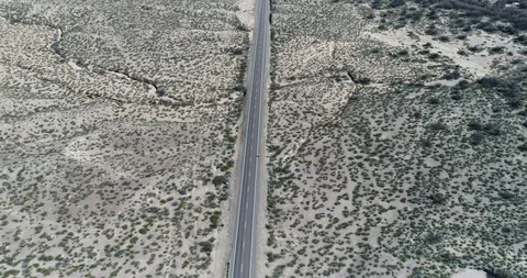 Pull back tracking motion with cyclist shows southern New Mexico drone aerial 4K Stock Footage 111312847