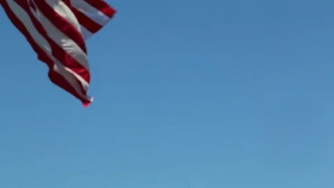Pull Back From US Flag Closeup to Flag Over Two Canons Stock Footage 69223517
