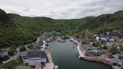 Pull back wide reveal of Petty Harbour, Newfoundland Stock Footage 220943902