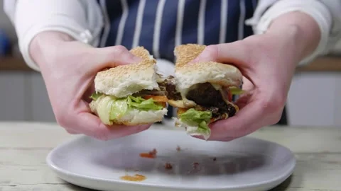 Pull Burger Apart with Stringy Cheese Stock Footage 166862947