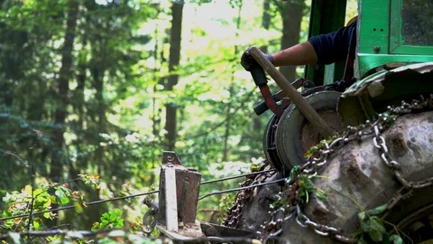 Pull cable cut trees from tractor Stock Footage 105428007