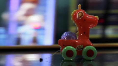 A Pull Cord Giraffe Toy on a Table in Arcade Game Room Inside a Shopping Mall. Video stock 103347168