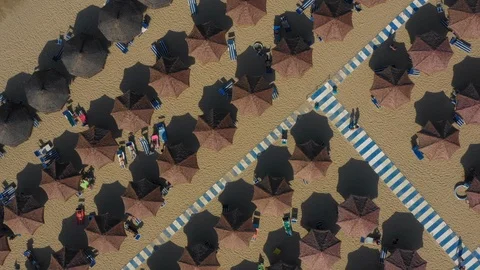 Pull Up Drone Shot Of Beach Umbrellas, Walkway And Italian Beach Stock Footage 120039432