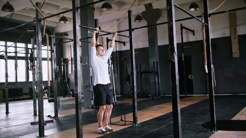 Pull-up exercise in the gym or office for beginners and intermediate Stock Footage 112016599